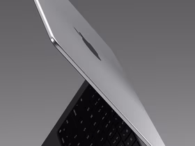 MacBook Pro в раскрытом виде на сером минималистичном фоне