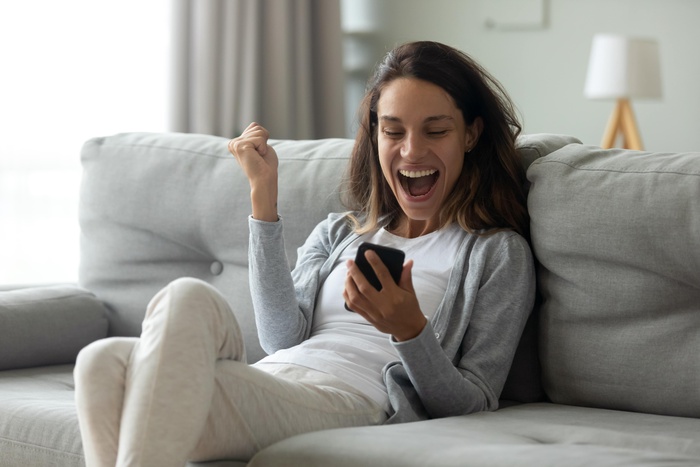 joyful woman with phone